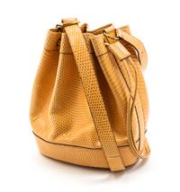 An Hermes Peach Lizardskin Drawstring Bag, 9 x 7 x 3 inches.