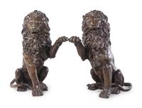 A Pair of Patinated Bronze Lions