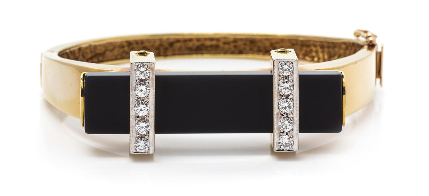 A Yellow Gold, Diamond and Onyx Bangle Bracelet, 25.50 dwts.