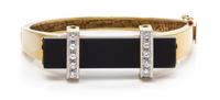 A Yellow Gold, Diamond and Onyx Bangle Bracelet, 25.50 dwts.