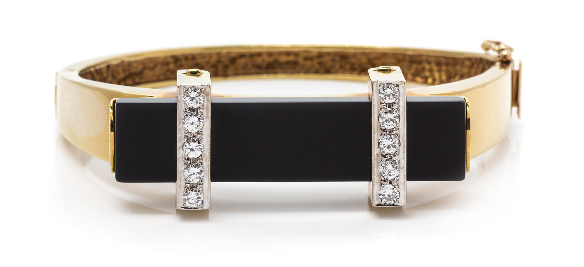 A Yellow Gold, Diamond and Onyx Bangle Bracelet, 25.50 dwts.