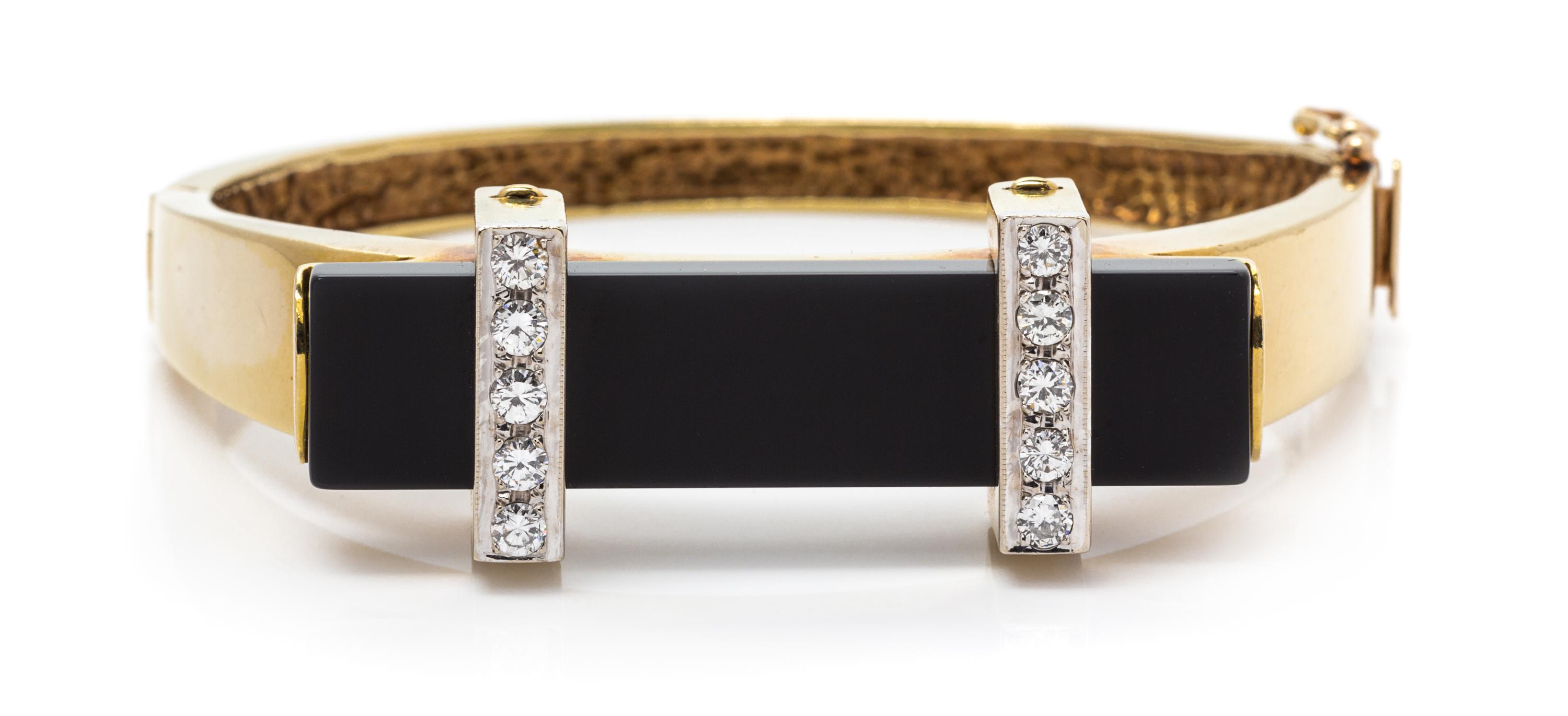 A Yellow Gold, Diamond and Onyx Bangle Bracelet, 25.50 dwts.