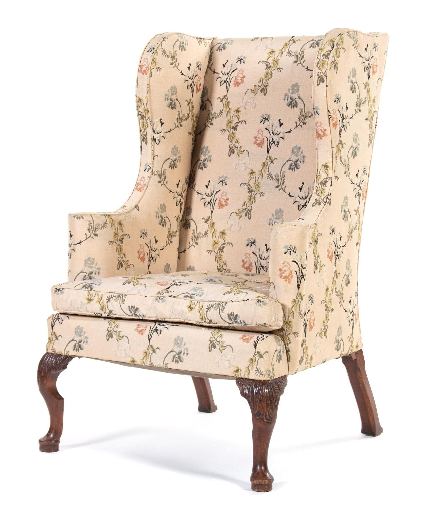 A Queen Anne Carved Mahogany Wing Armchair