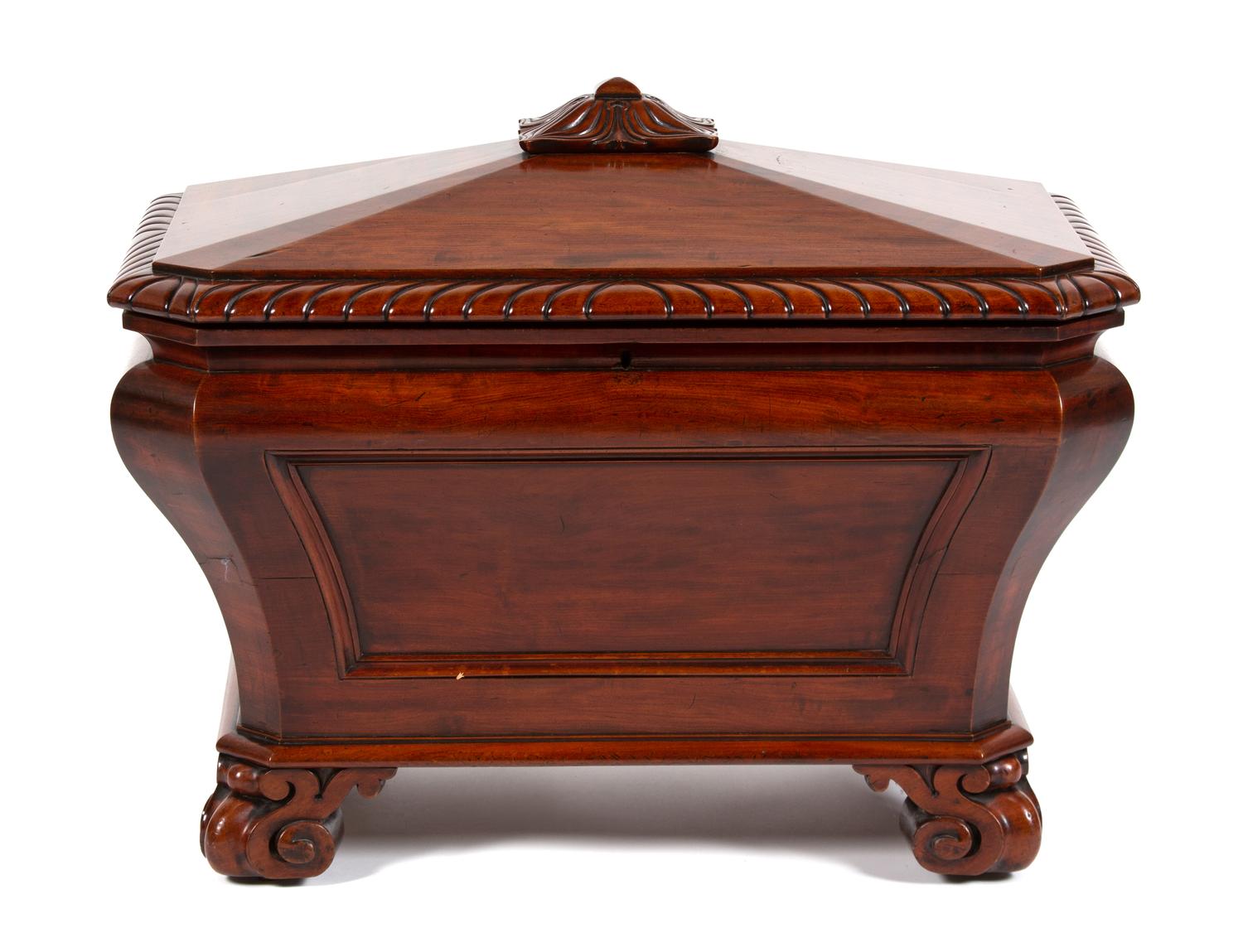 A Regency Style Carved Mahogany Cellarette Height 24 1/2 x width 30 1/2 x depth 20 1/4 inches. — 20TH CENTURY