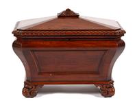 A Regency Style Carved Mahogany Cellarette Height 24 1/2 x width 30 1/2 x depth 20 1/4 inches. — 20TH CENTURY