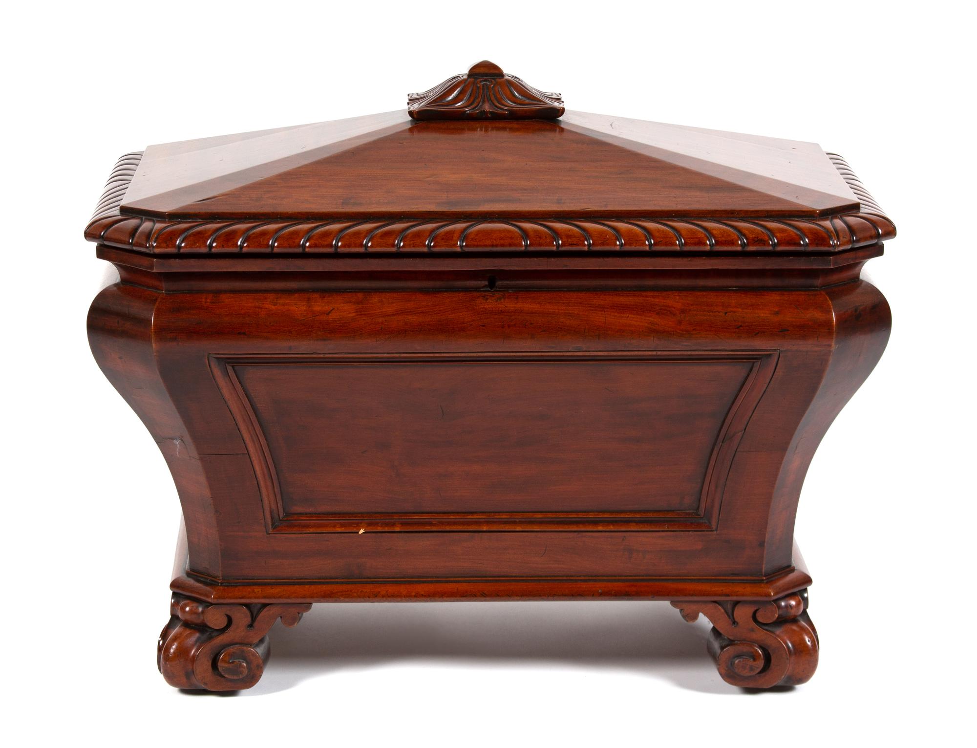 A Regency Style Carved Mahogany Cellarette Height 24 1/2 x width 30 1/2 x depth 20 1/4 inches. — 20TH CENTURY