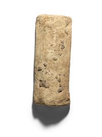 A Mesopotamian Terracotta Mold of a Nude Female