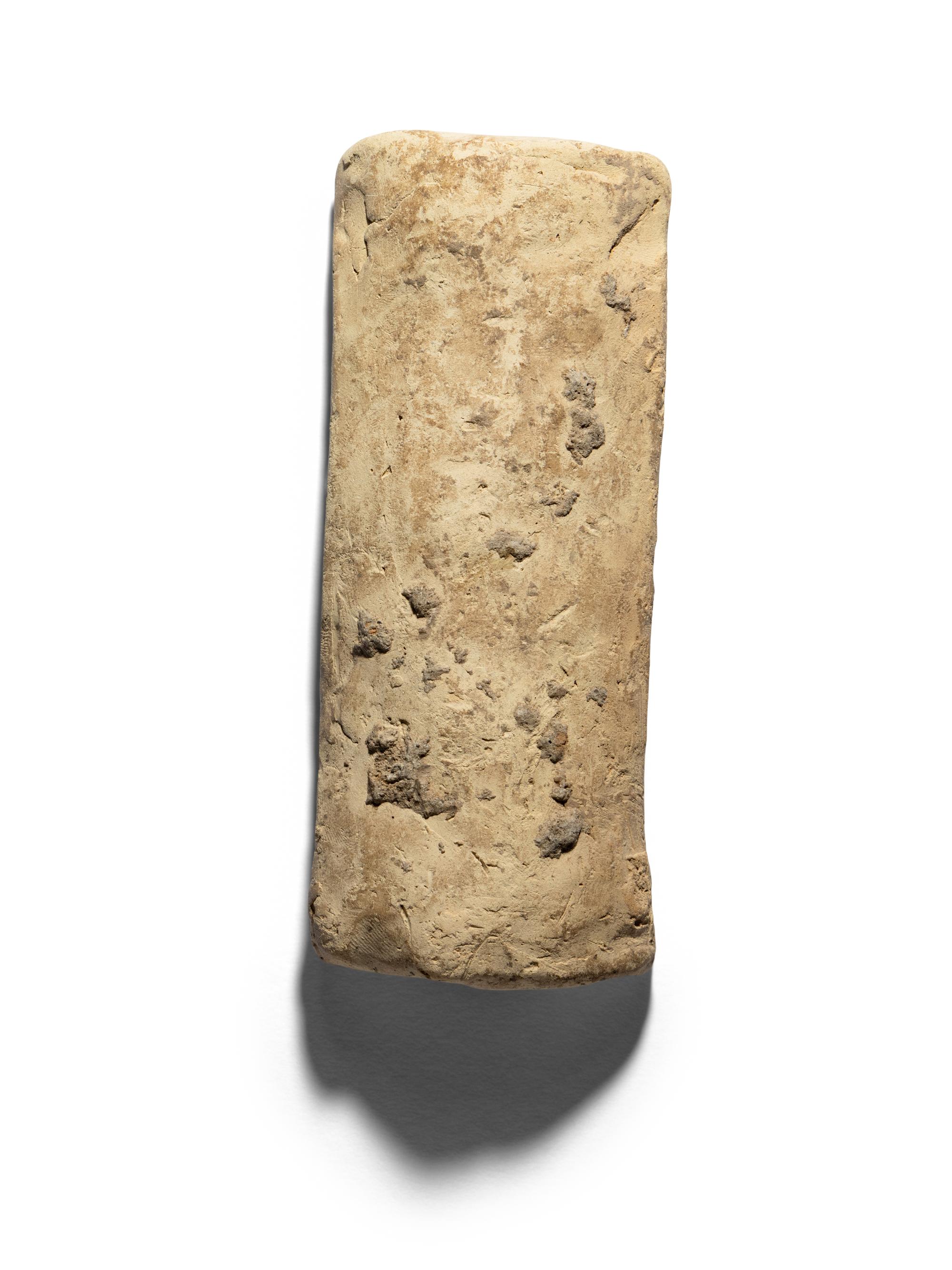 A Mesopotamian Terracotta Mold of a Nude Female