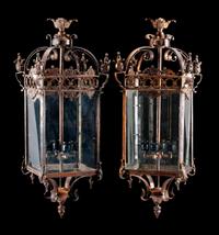 A Pair of Continental Patinated Metal Lanterns Height 18 inches.