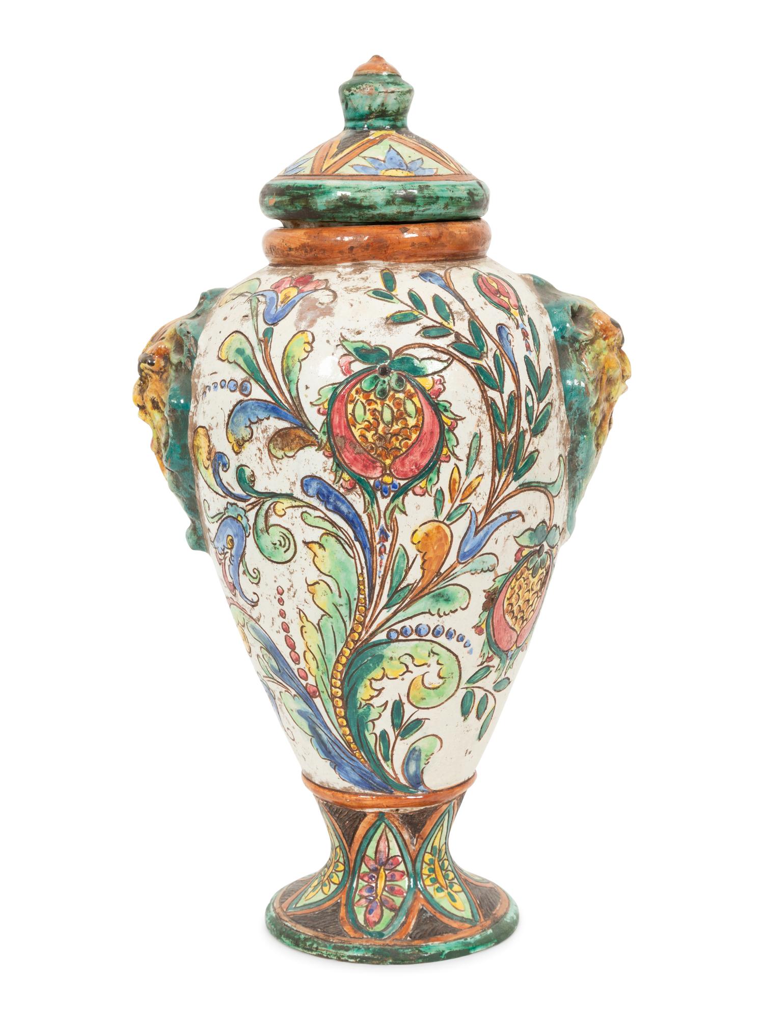 An Italian Majolica Covered Urn with Lion Mask Handles