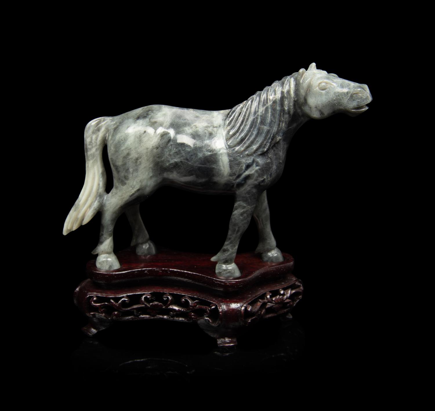 A Small Set of Eight Grey Jadeite Figures of Horses