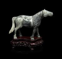 A Small Set of Eight Grey Jadeite Figures of Horses