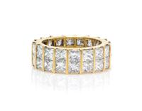 An 18 Karat Yellow Gold and Diamond Eternity Band, 5.50 dwts.