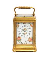 A Tiffany Gilt Bronze Carriage Clock Height 6 3/4 inches with handle up. — 20TH CENTURY