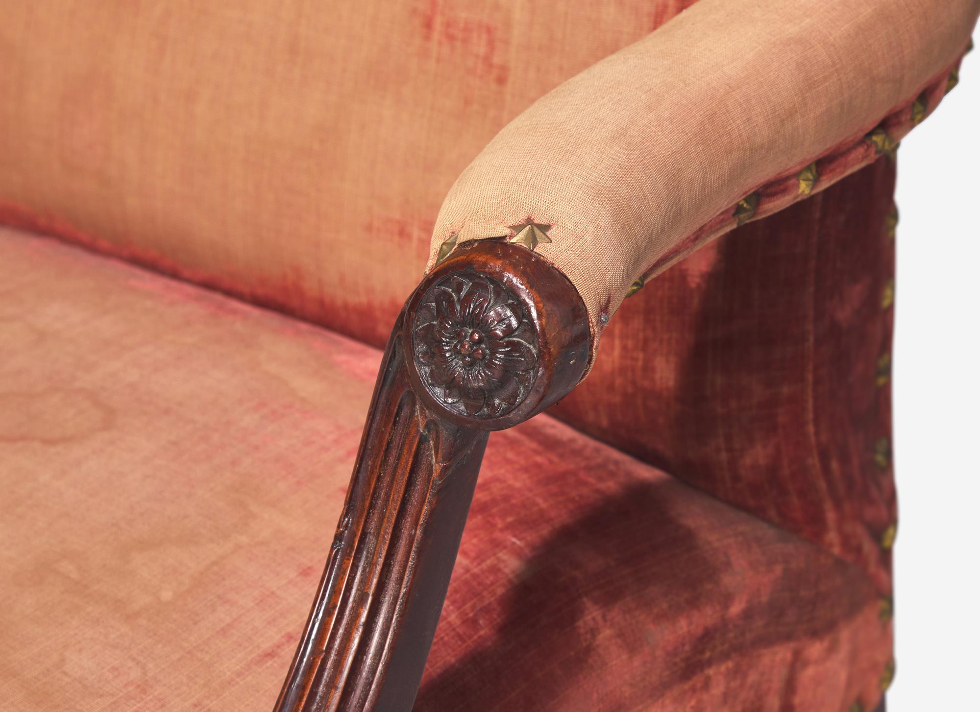 A Near Pair of George III Mahogany Library Armchairs