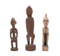 Three Carved Wood African Figures Height of tallest 14 inches.