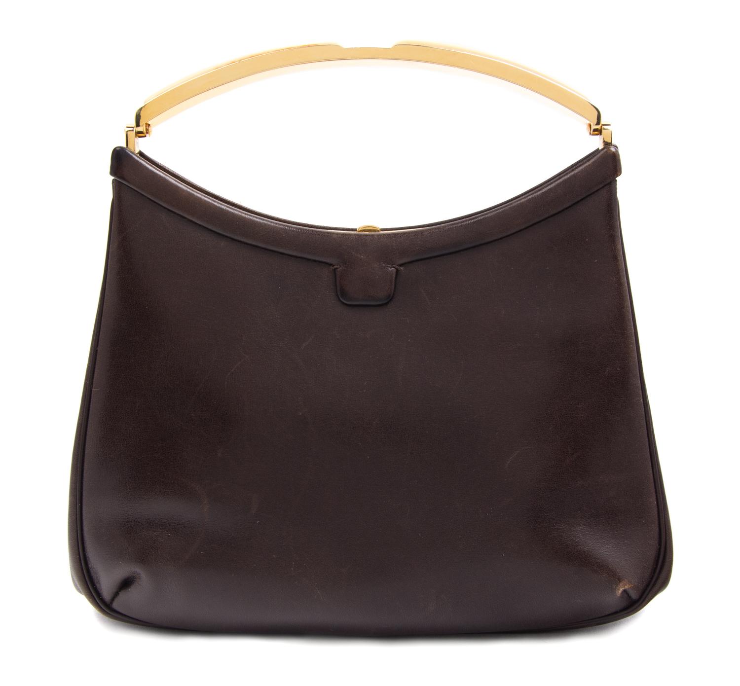 A Judith Leiber Brown Leather Clutch, 7.5" x 5.5" x 1.5".