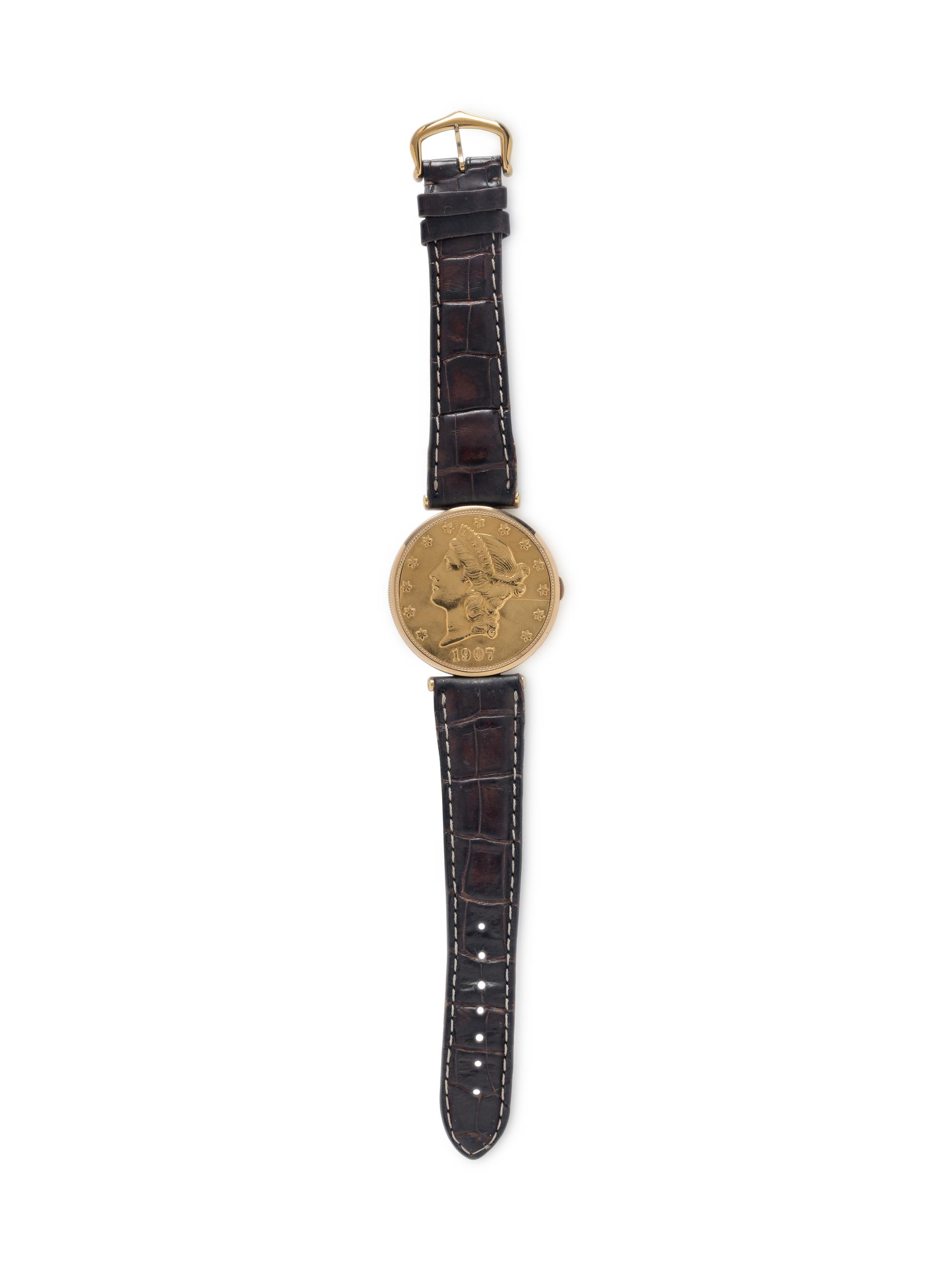 CORUM, 18K YELLOW GOLD HIDDEN DIAL COIN WATCH