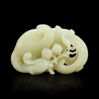 A Chinese carved white jade "Phoenix and Peach" large ornament