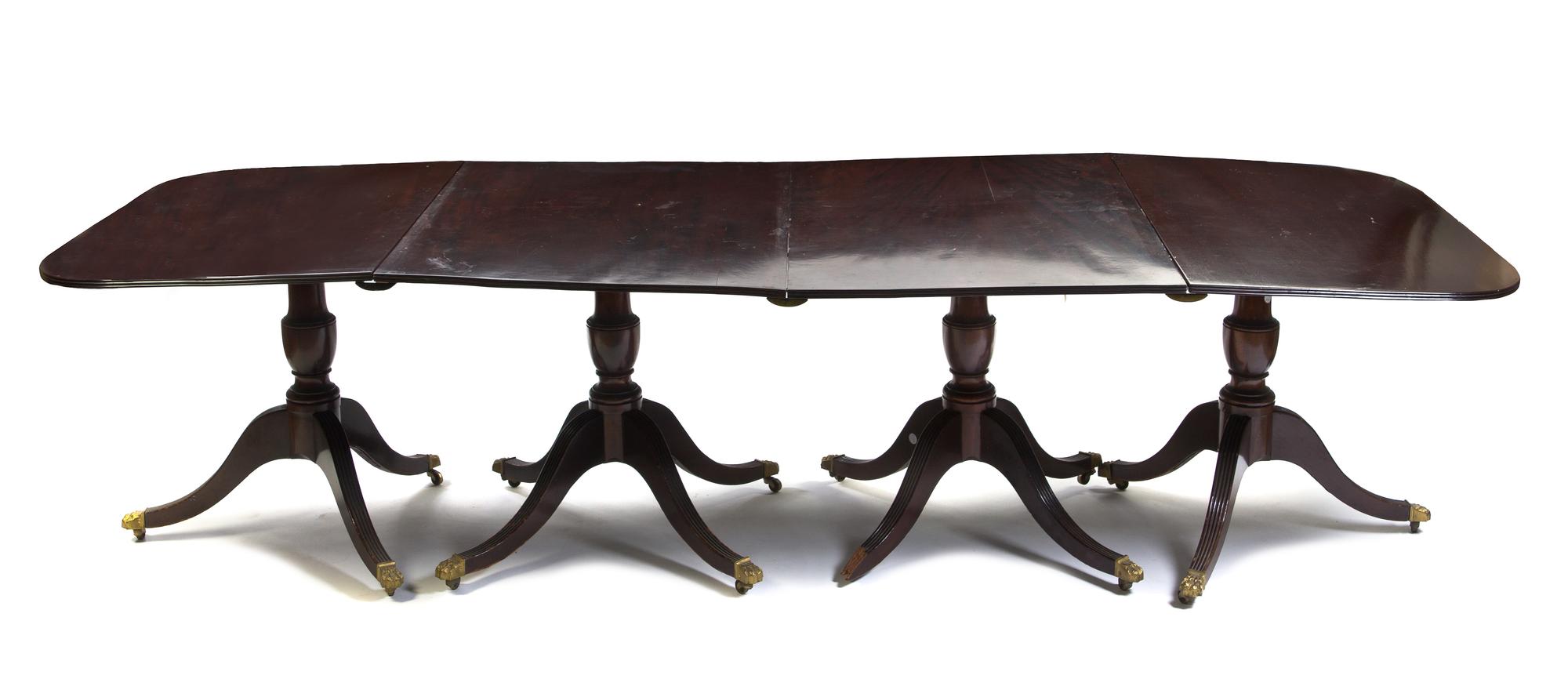 A Georgian Style Mahogany Quadruple Pedestal Dining Table, Height 29 3/4 x width 115 3/4 x depth 43 1/4 inches, together with 3 additio