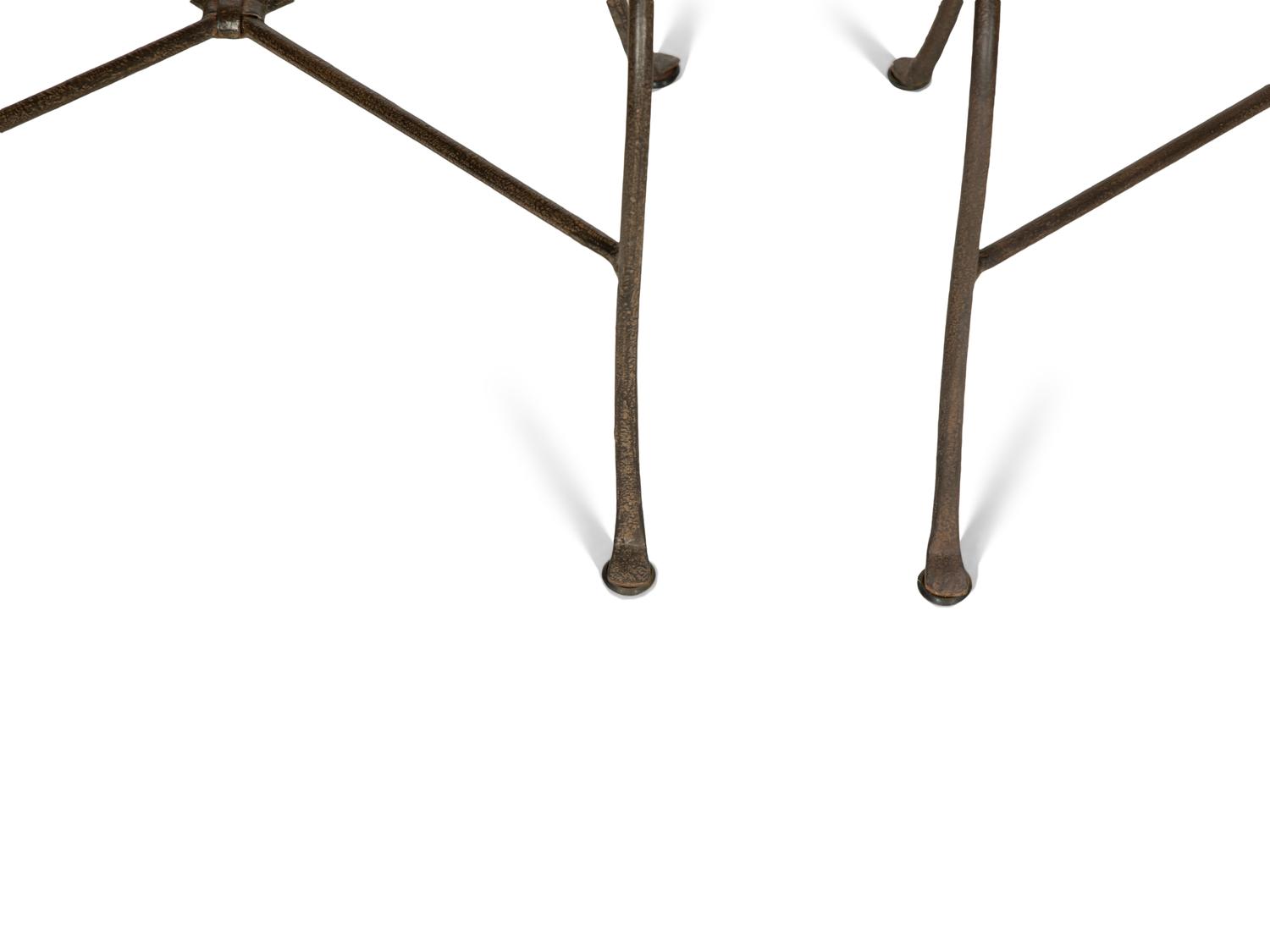 A Set of Seven Patinated Metal Dining Chairs