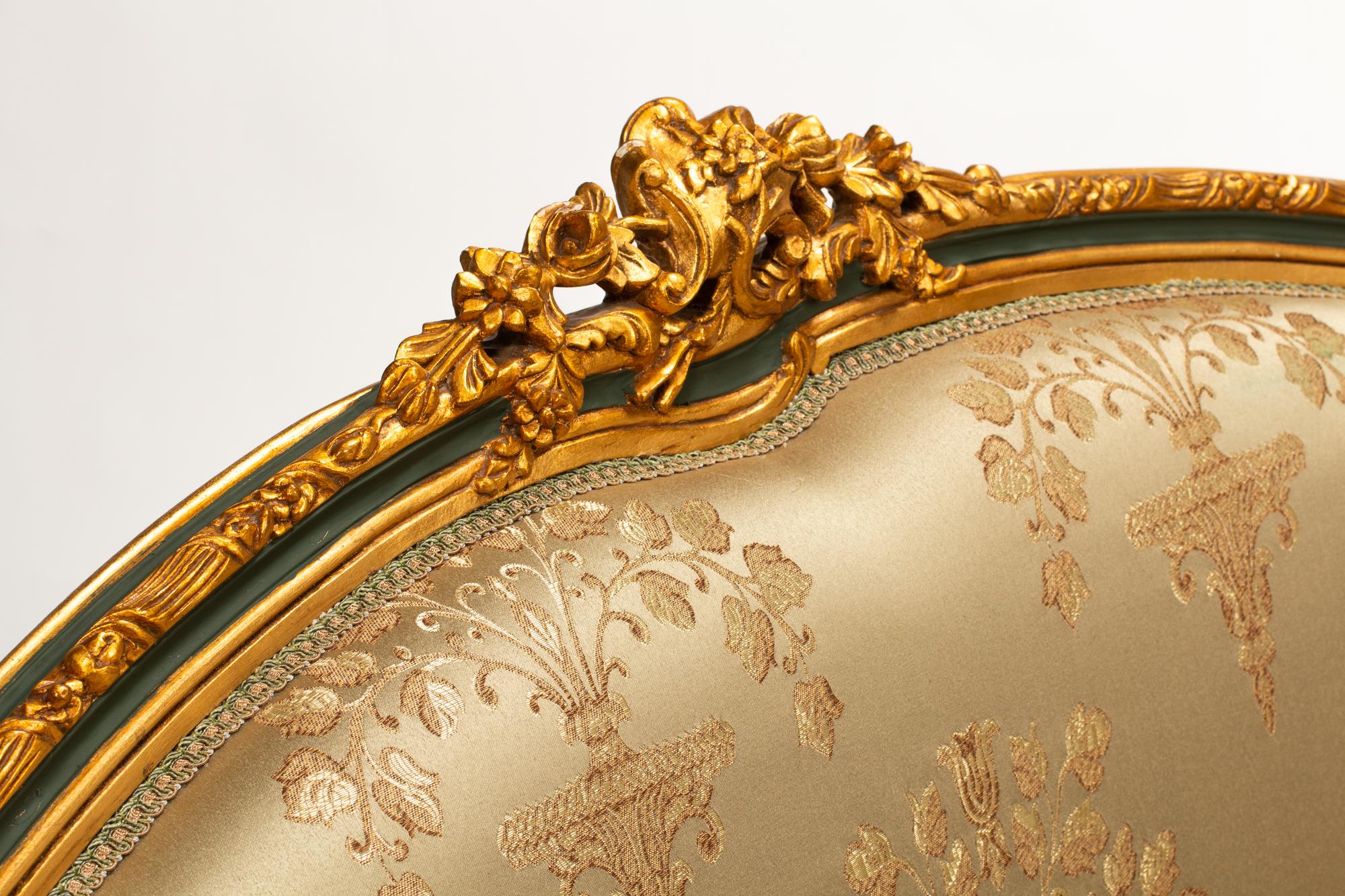 A Pair of Louis XV Style Painted and Parcel Gilt Settees