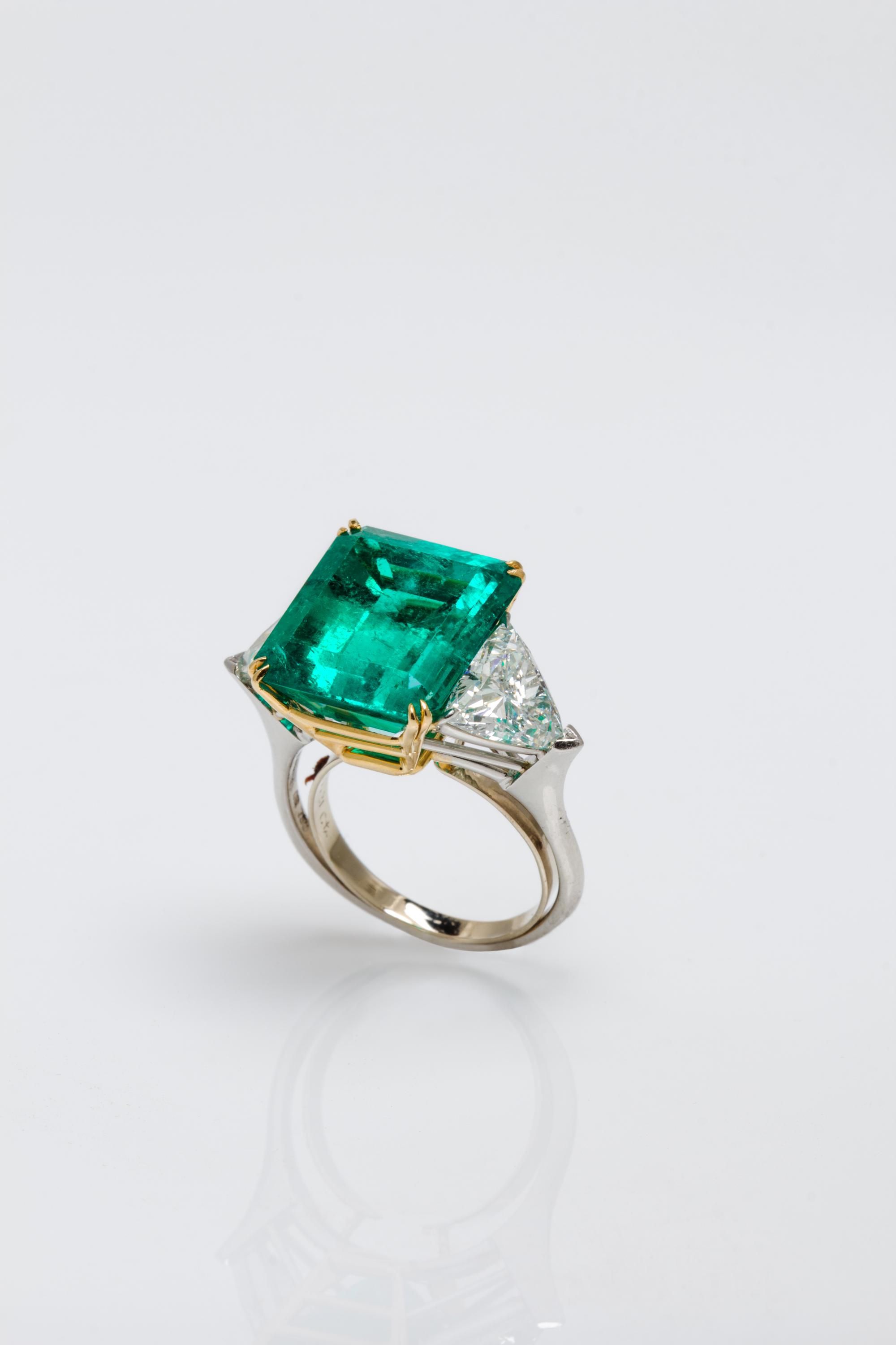 A Platinum, 18 Karat Yellow Gold, Emerald and Diamond Ring, Harry Winston, 6.20 dwts.