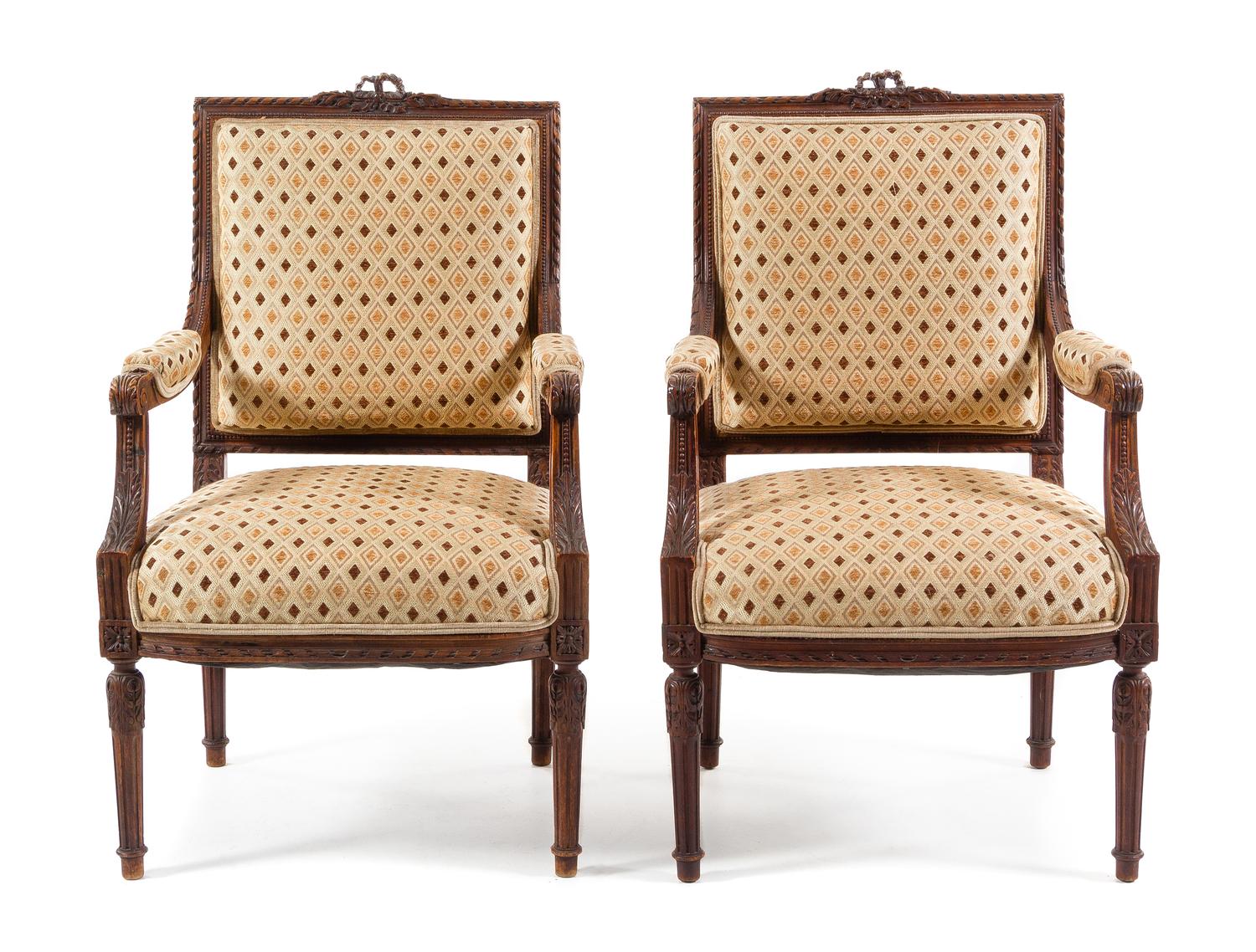 A Pair of Louis XVI Style Walnut Fauteuils Height 39 1/8 inches. — 19TH CENTURY