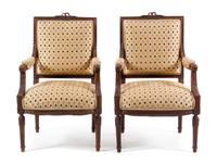 A Pair of Louis XVI Style Walnut Fauteuils Height 39 1/8 inches. — 19TH CENTURY