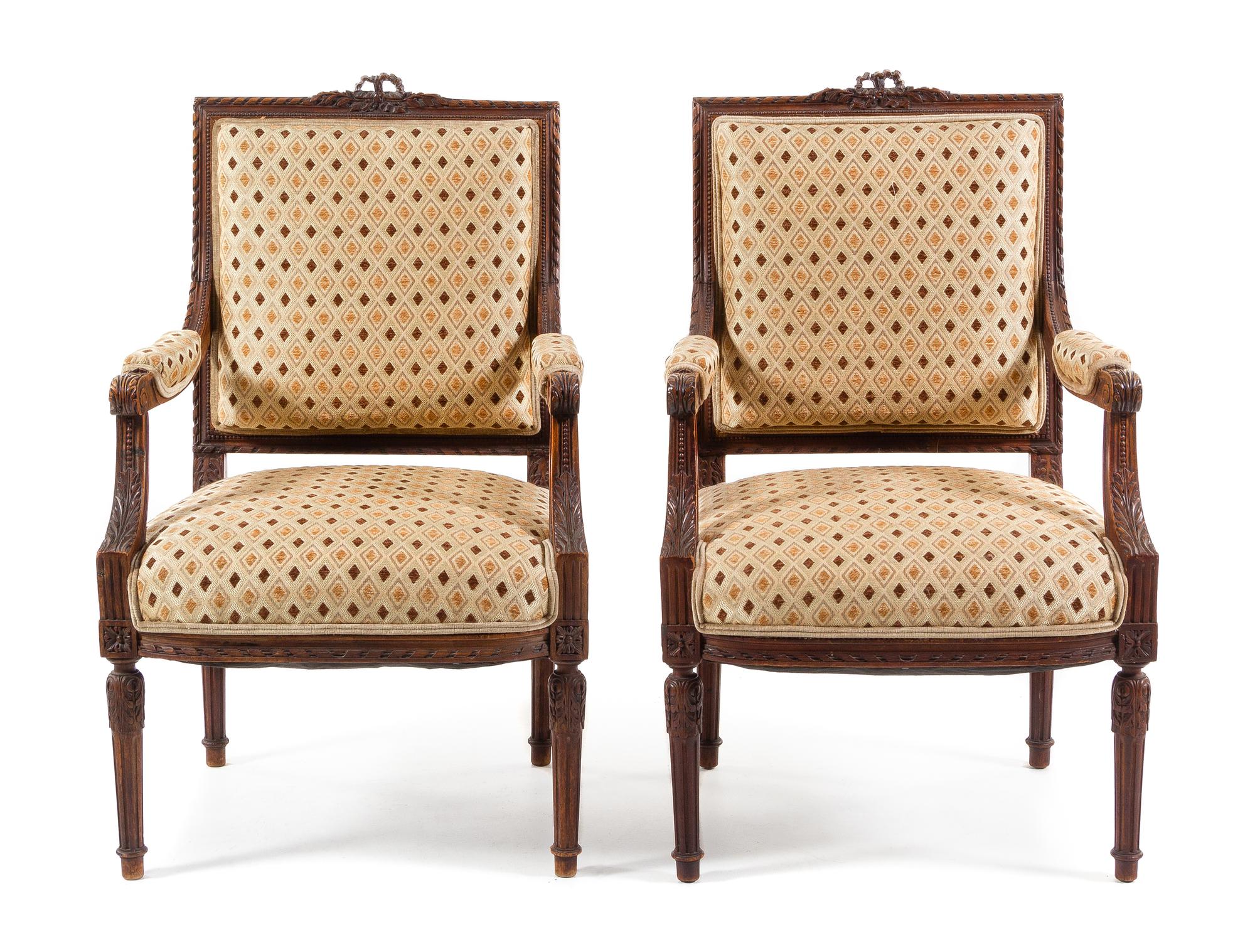A Pair of Louis XVI Style Walnut Fauteuils Height 39 1/8 inches. — 19TH CENTURY