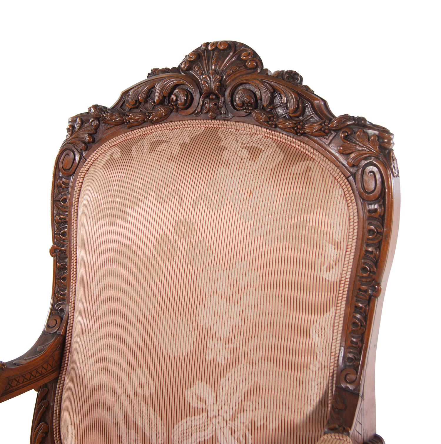 A Louis XV Style Carved Walnut Fauteuil