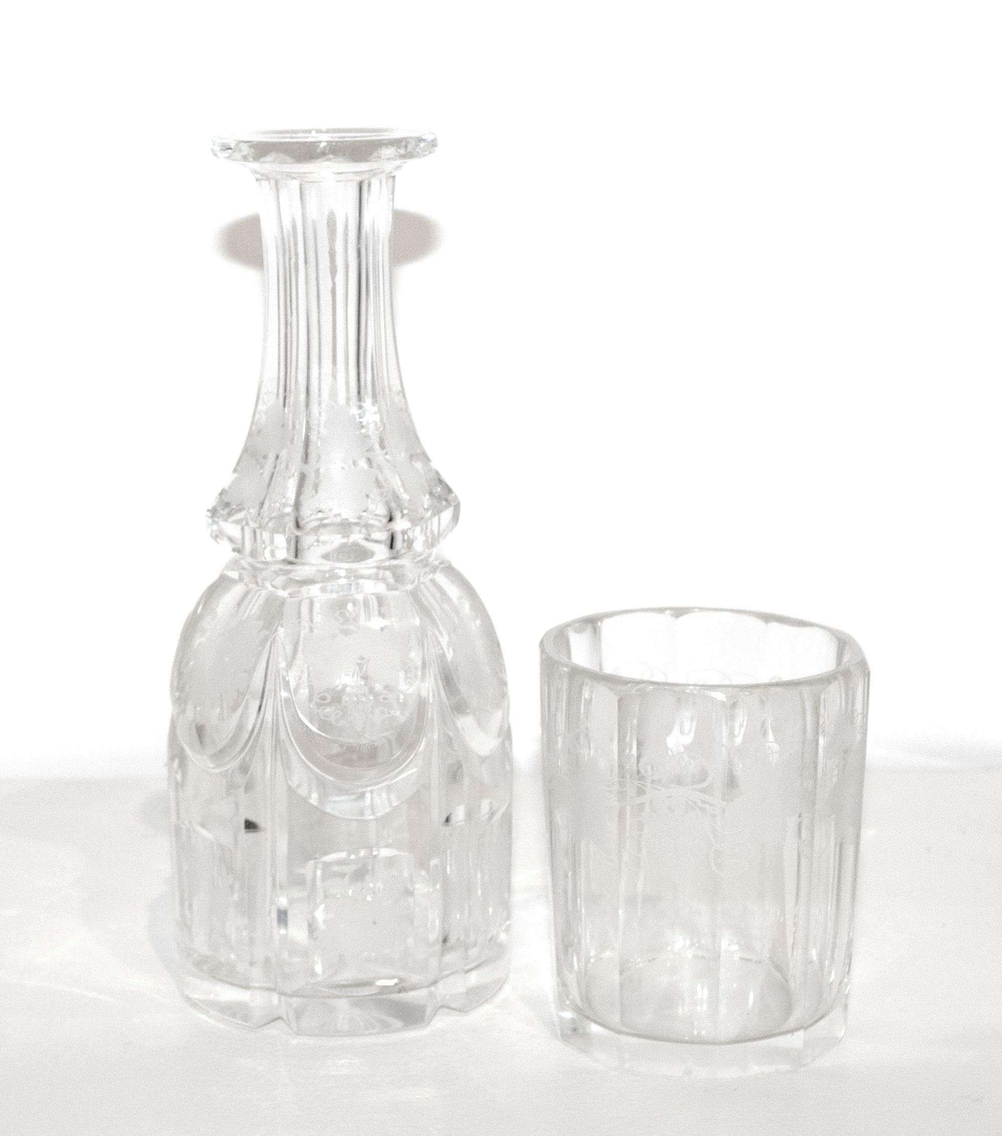 An American Engraved Glass Water Glass and Carafe