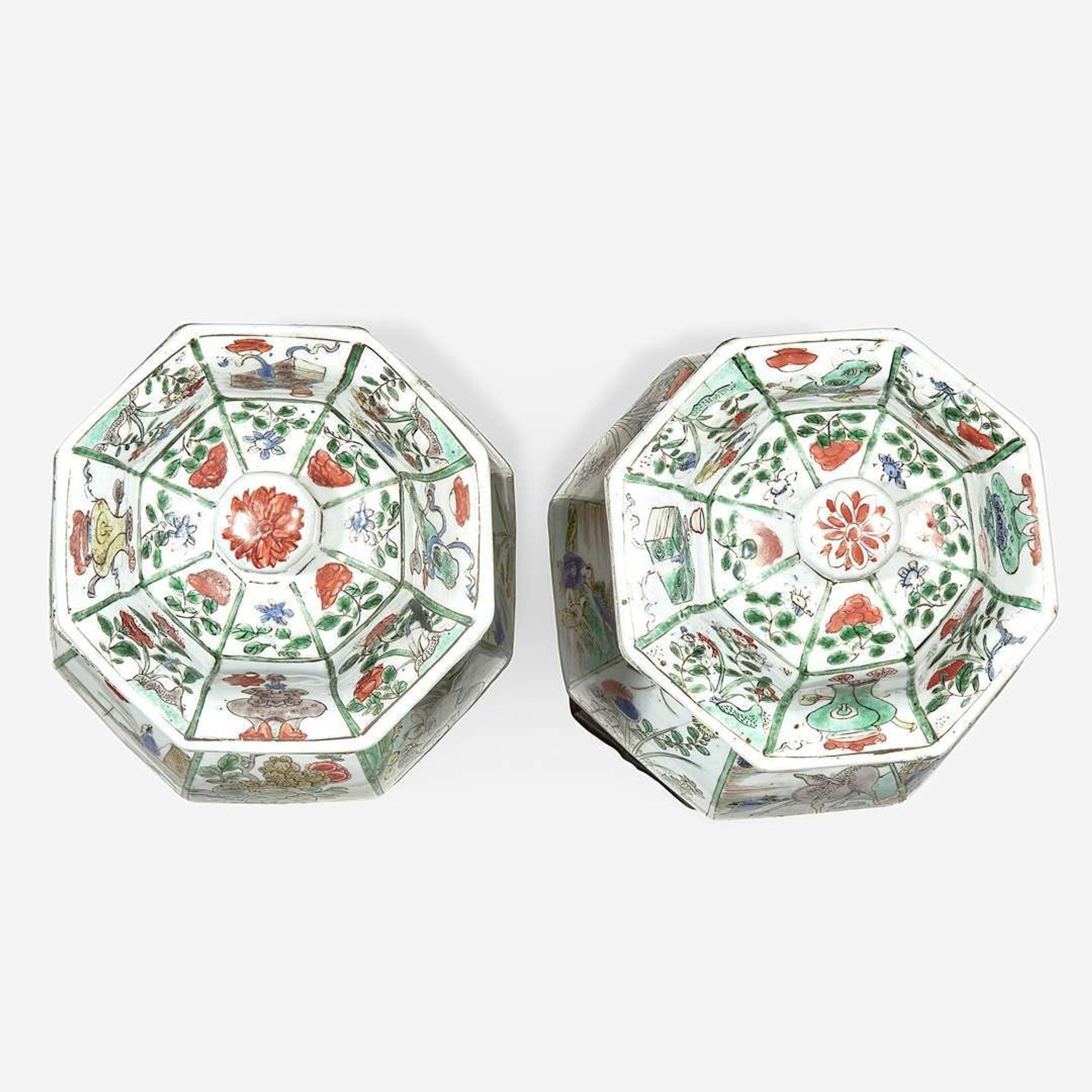 A pair of Chinese famille verte-decorated octagonal baluster vases and covers Kangxi period