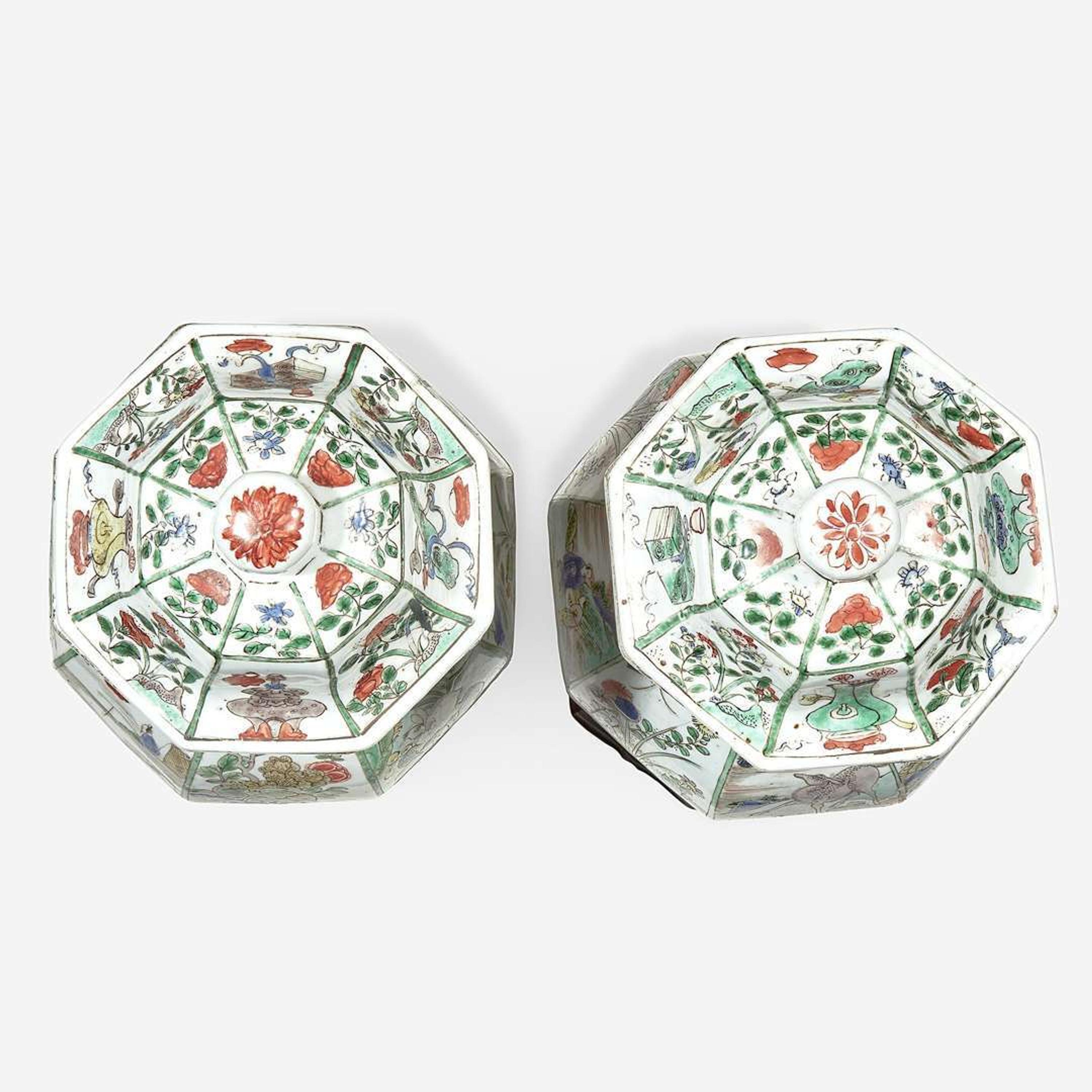 A pair of Chinese famille verte-decorated octagonal baluster vases and covers Kangxi period