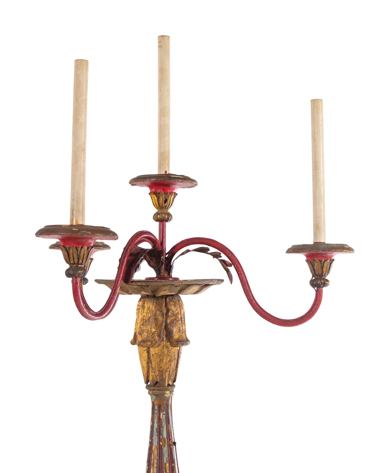 A Pair of Italian Painted and Parcel Gilt Four-Light Torchères