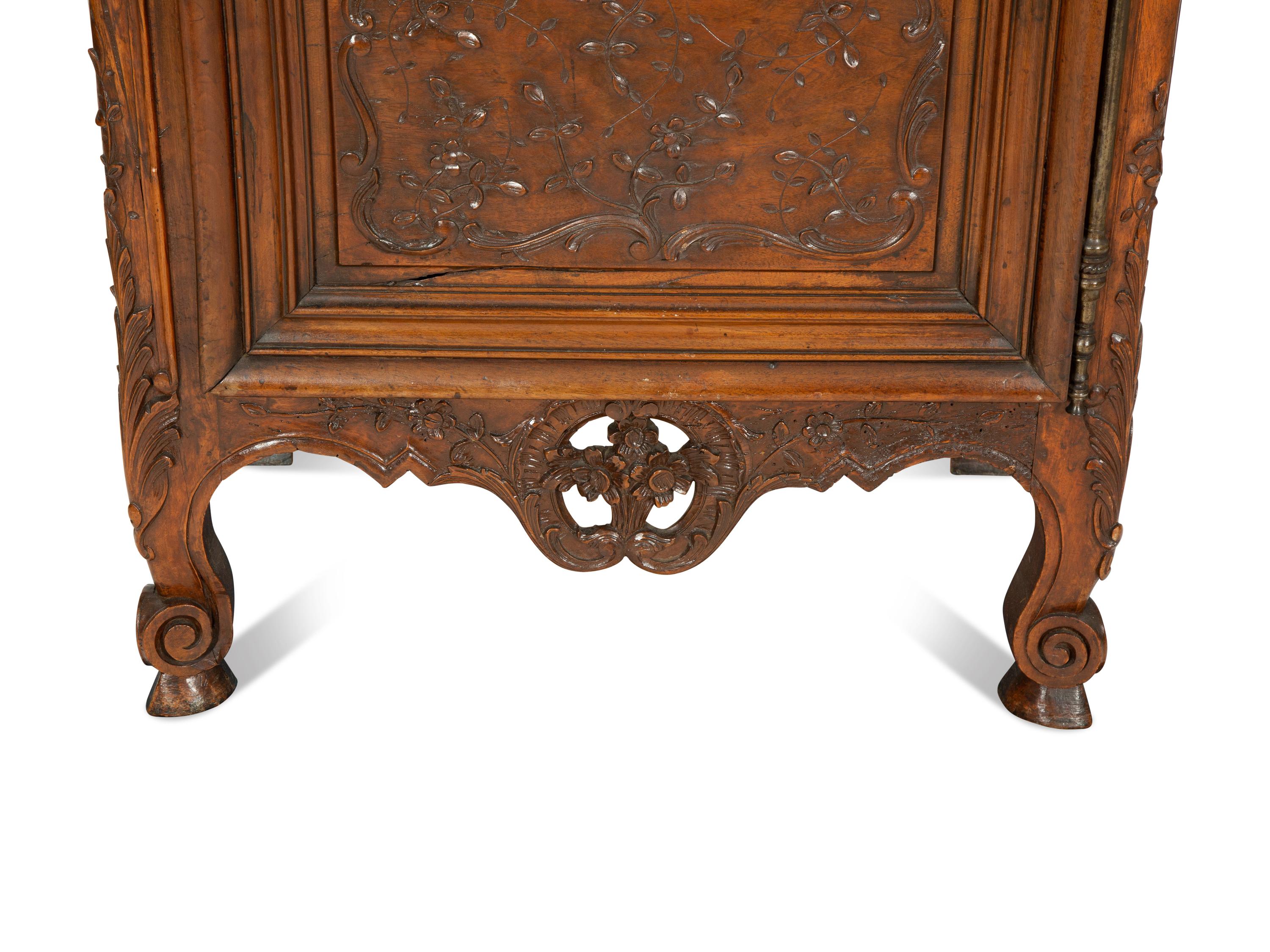 A French Provincial Carved Walnut Panettière