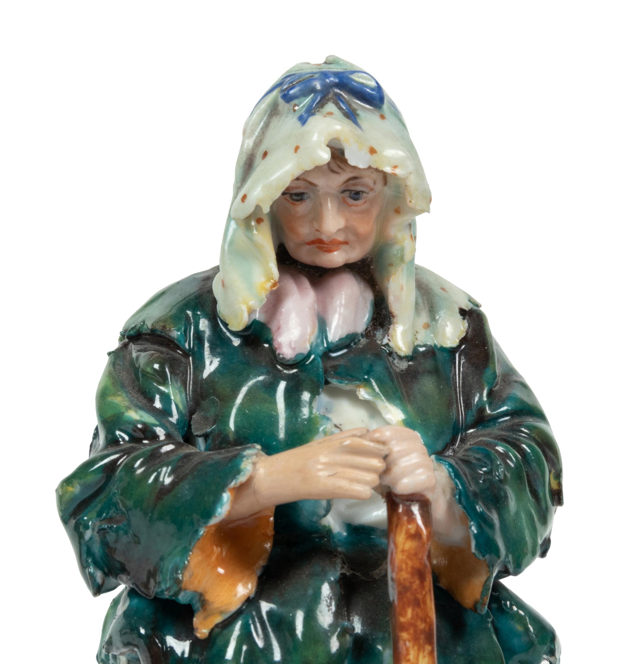 A Pair of Gilt Metal Mounted Porcelain Figures