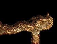 A Set of Gongs with Matching Carved Gilt and Red Lacquered Wood Stand