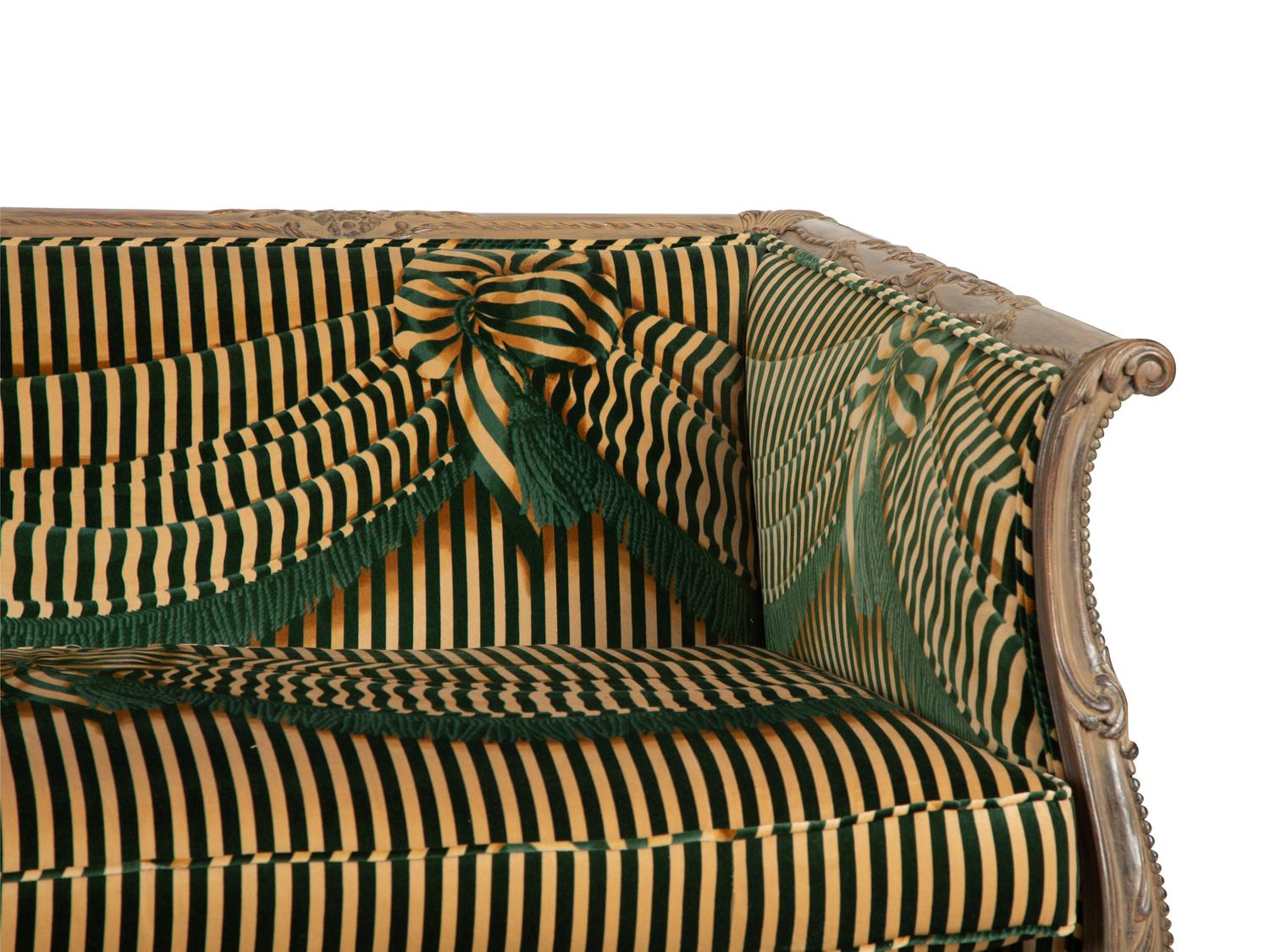 A Louis XV Style Carved and Stained Mahogany Sofa