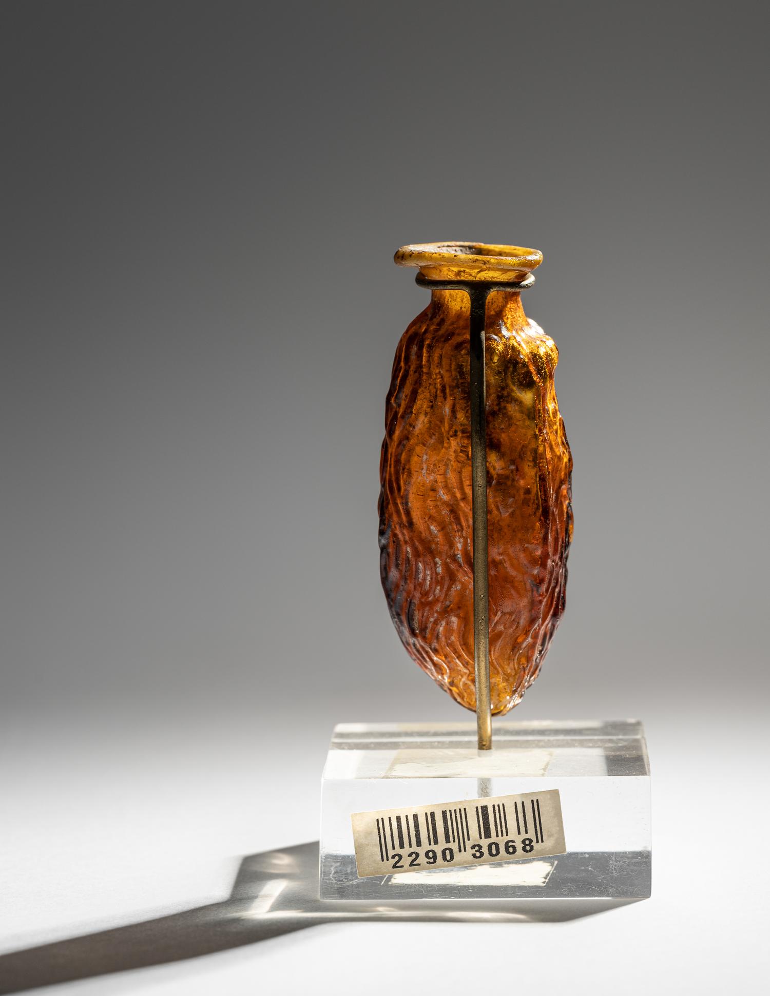 A Roman Amber Glass Date Flask