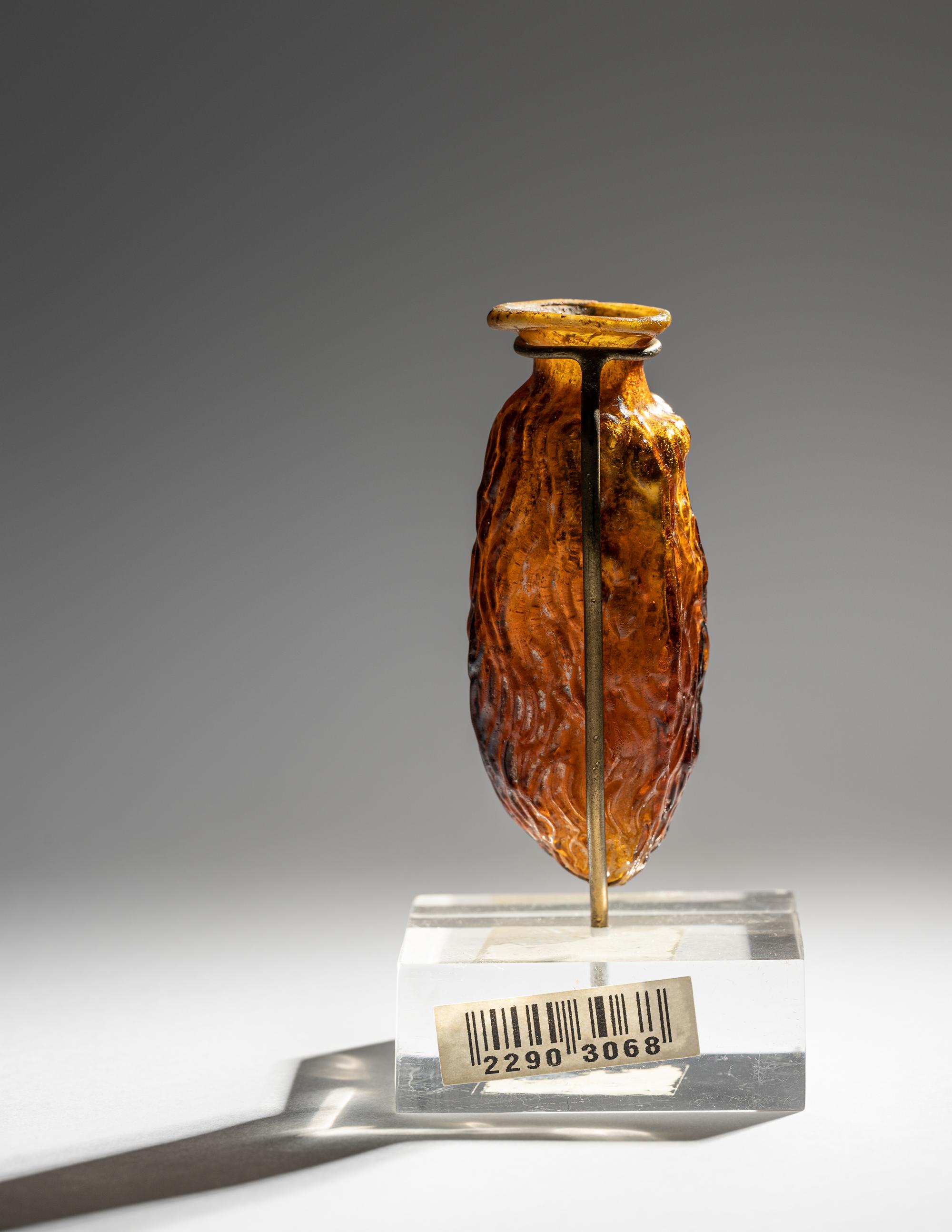 A Roman Amber Glass Date Flask