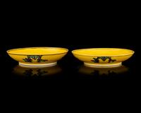 A Pair of Chinese Yellow Ground Green and Aubergine Enameled Porcelain 'Double Dragon' Dishes