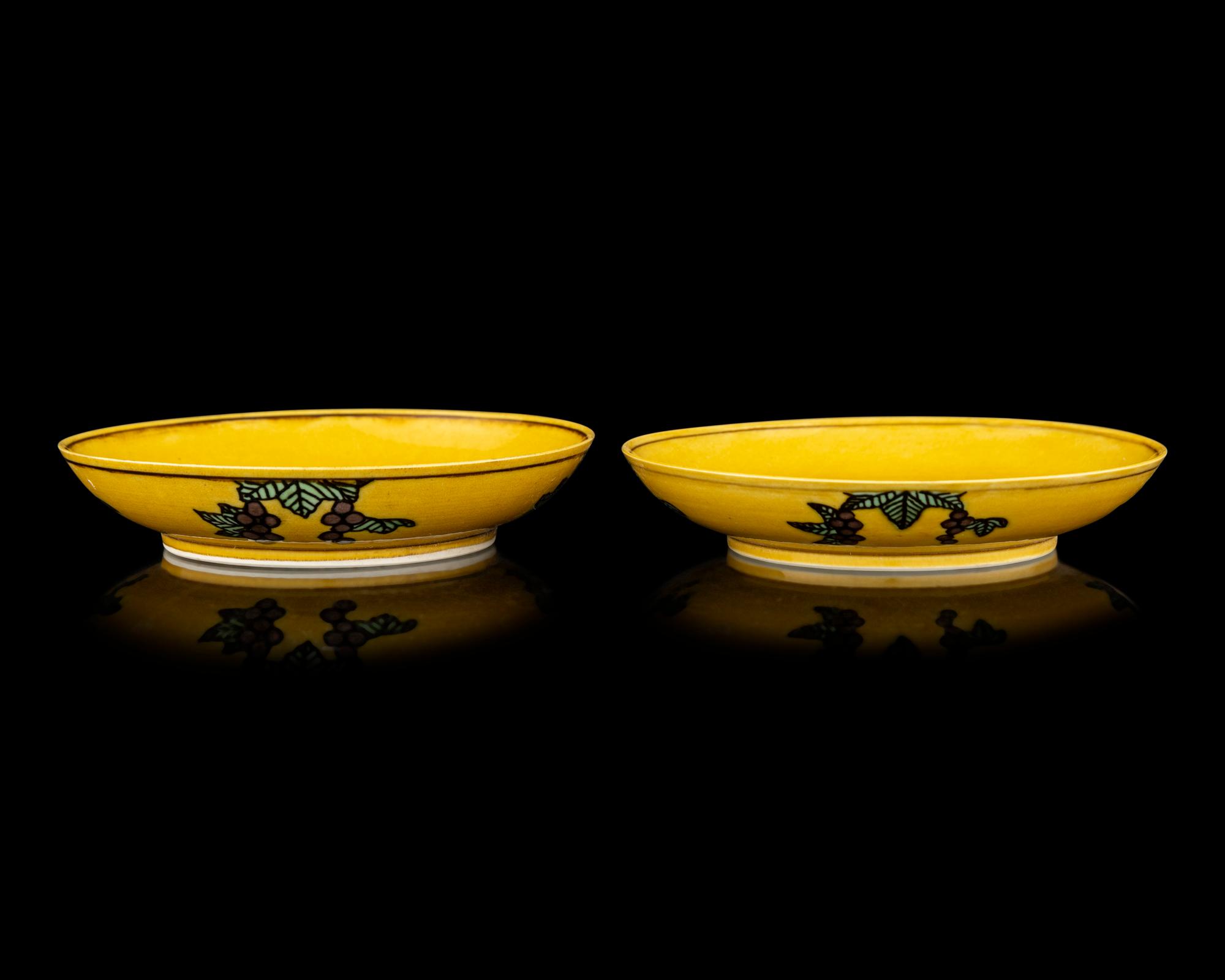 A Pair of Chinese Yellow Ground Green and Aubergine Enameled Porcelain 'Double Dragon' Dishes