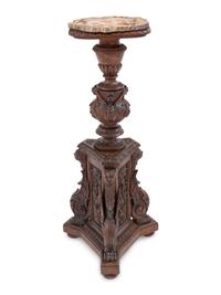 An Italian Carved Walnut Tripartite Pedestal