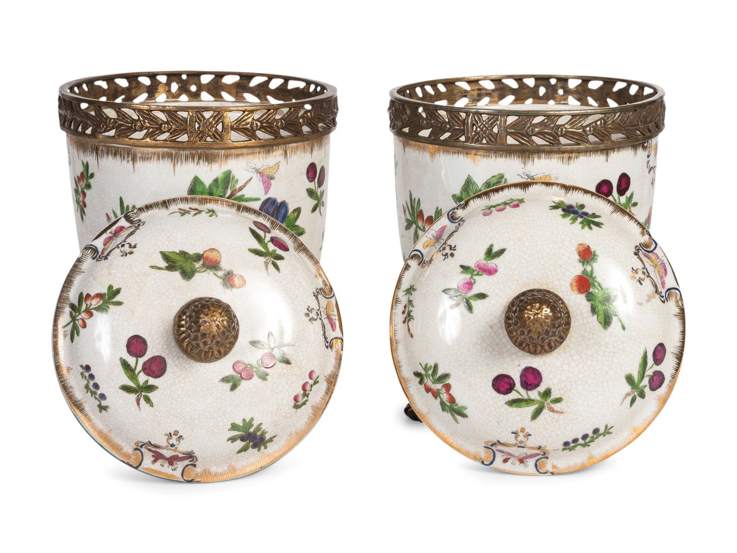 A Pair of United Wilson Gilt Metal Mounted Porcelain Urns