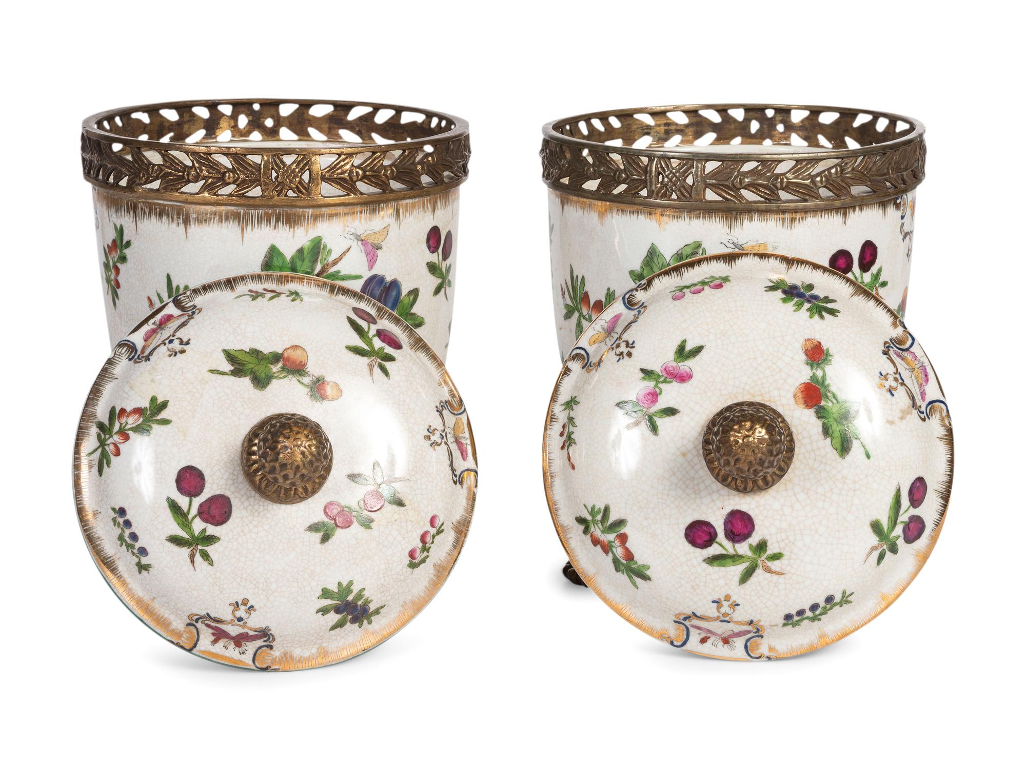 A Pair of United Wilson Gilt Metal Mounted Porcelain Urns
