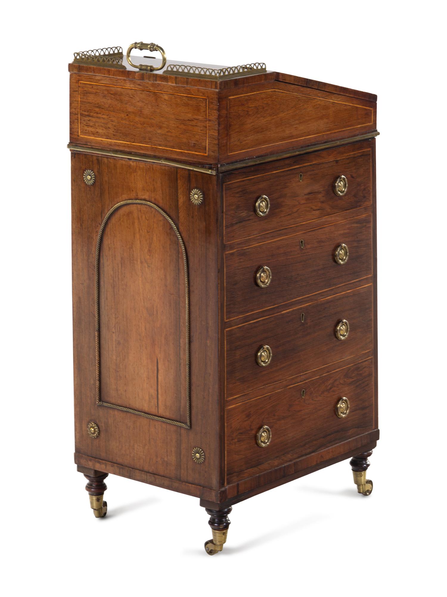 A Regency Brass Mounted and Leather-Inset Mahogany Davenport Desk
