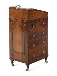 A Regency Brass Mounted and Leather-Inset Mahogany Davenport Desk