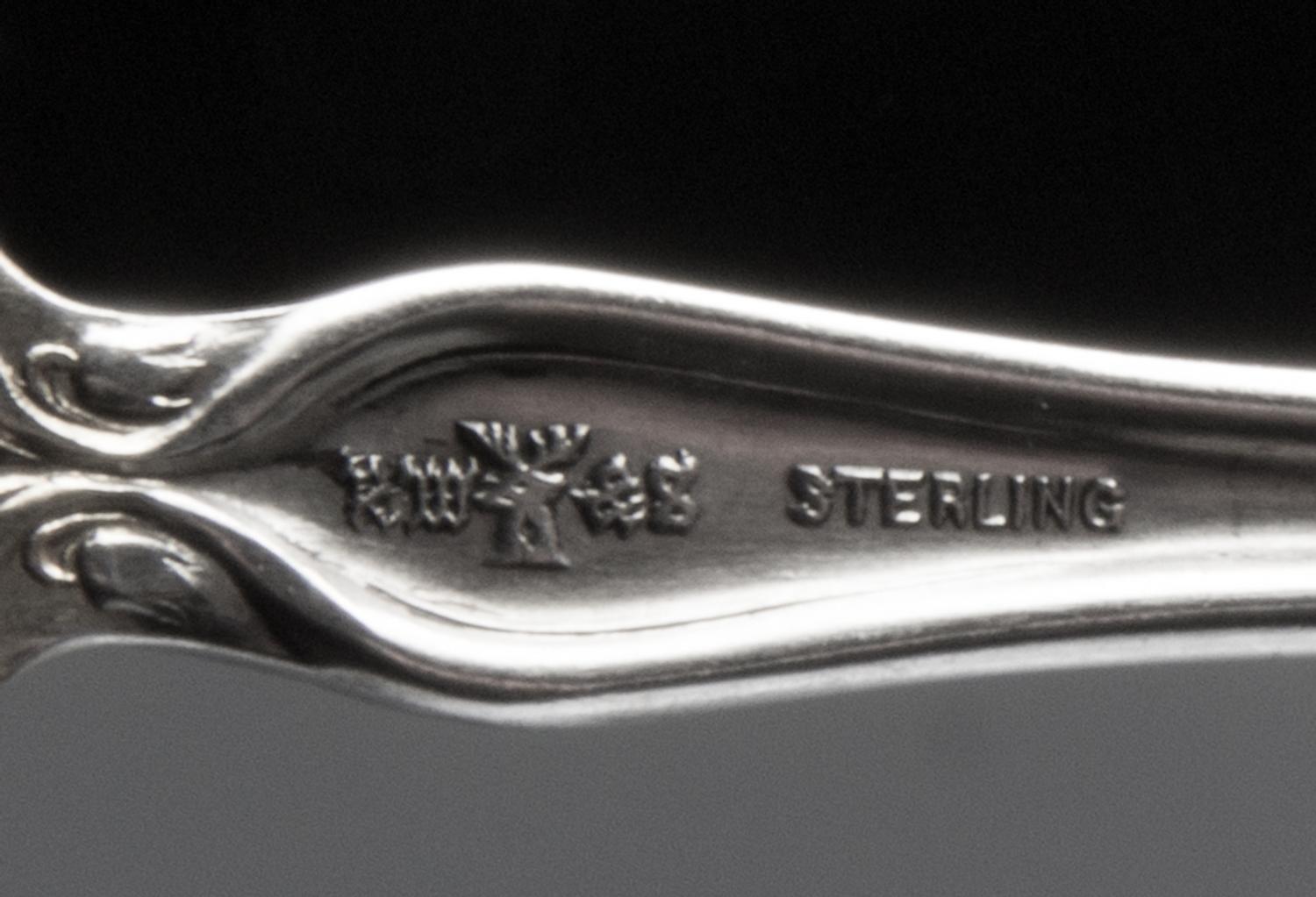 Two American Art Nouveau Silver Servers, , comprising a sauce ladle, R. Wallace & Sons Mfg. Co., Wallingford, CT and a sugar server.
