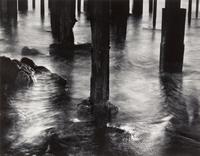 Wynn Bullock, (American, 1902-1975), Pilings under Cannery Row, 1958
